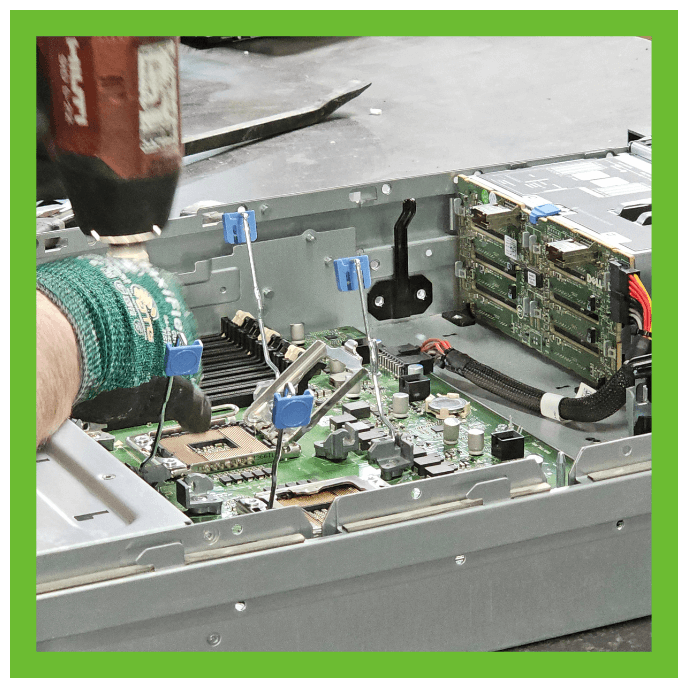 Technician working on processing e-reycling.